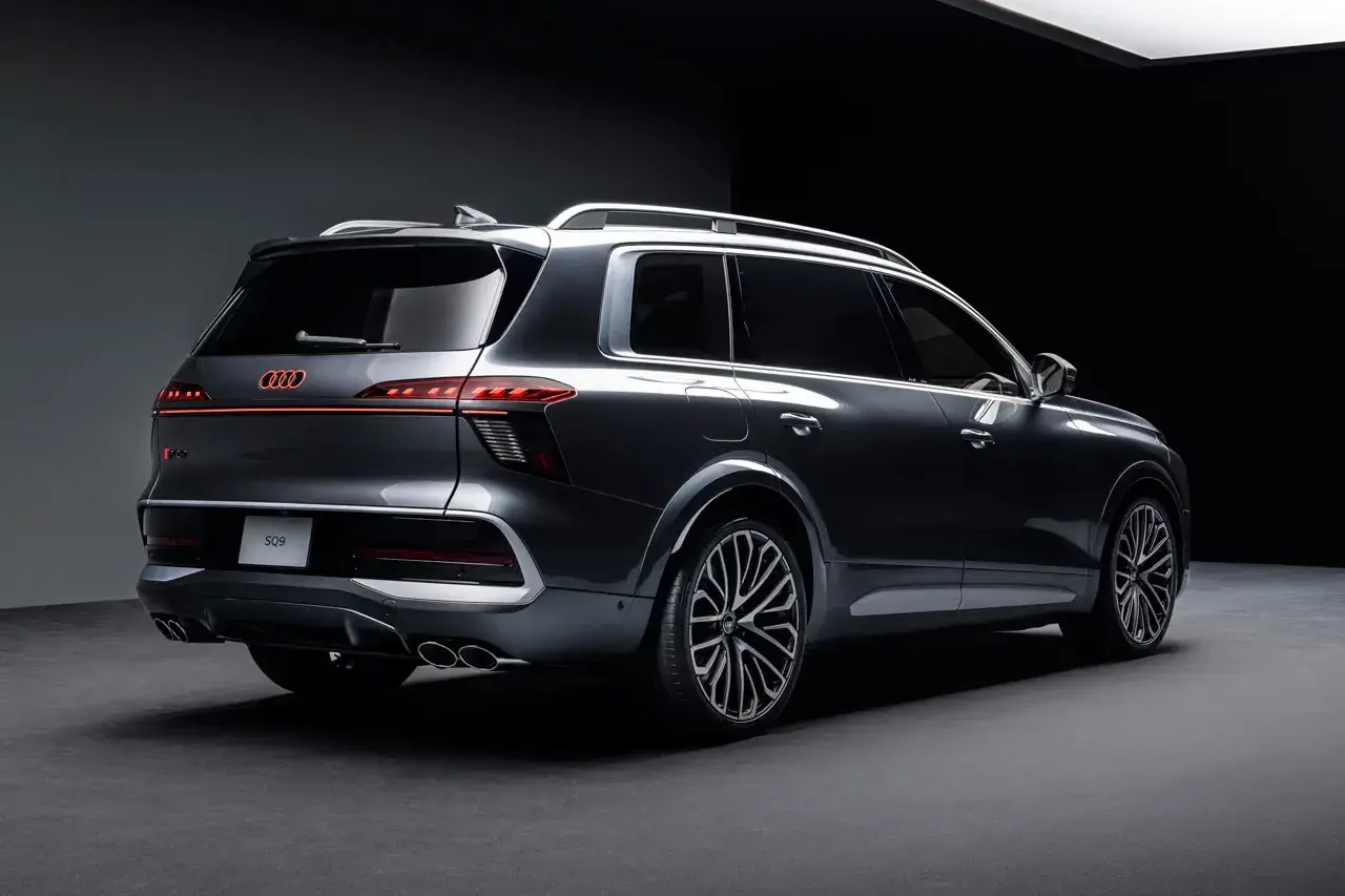 AUDI DEBUTS FULL SIZE Q9 SUV FAMILY image explaining Audi's new Q9 and SQ9 vehicle models, including engine performance, dimensions, exterior light projectors, and seating layouts. (image 3 of 14)
