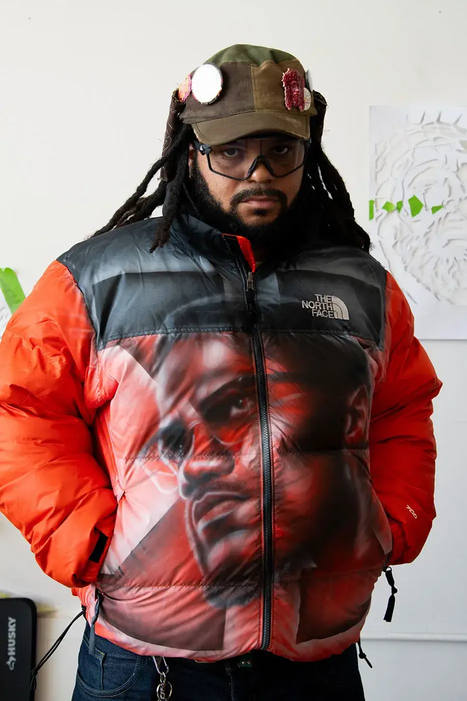 AWAKE NY AND THE NORTH FACE RELEASE 50 CUSTOM NUPTSE JACKETS image of Awake NY and The North Face made 50 hand-customized Nuptse jackets with artists Omi and Alehsy Lambo. Part of the run goes on sale on the Awake NY website on Monday, October 19, 2026, at 1 p.m.