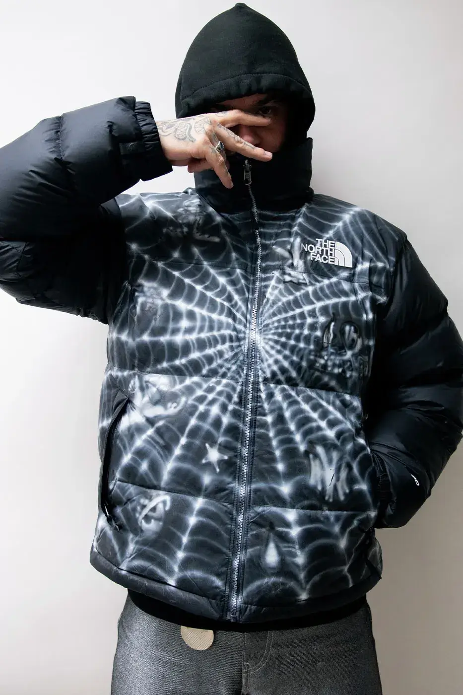 AWAKE NY AND THE NORTH FACE RELEASE 50 CUSTOM NUPTSE JACKETS image of Awake NY and The North Face made 50 hand-customized Nuptse jackets with artists Omi and Alehsy Lambo. Part of the run goes on sale on the Awake NY website on Monday, October 19, 2026, at 1 p.m. (image 3 of 10)