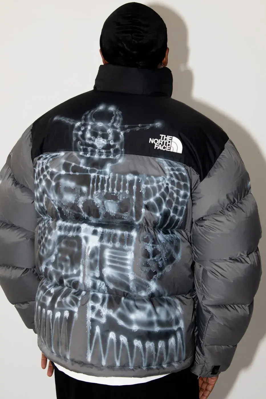 AWAKE NY AND THE NORTH FACE RELEASE 50 CUSTOM NUPTSE JACKETS image of Awake NY and The North Face made 50 hand-customized Nuptse jackets with artists Omi and Alehsy Lambo. Part of the run goes on sale on the Awake NY website on Monday, October 19, 2026, at 1 p.m. (image 6 of 10)