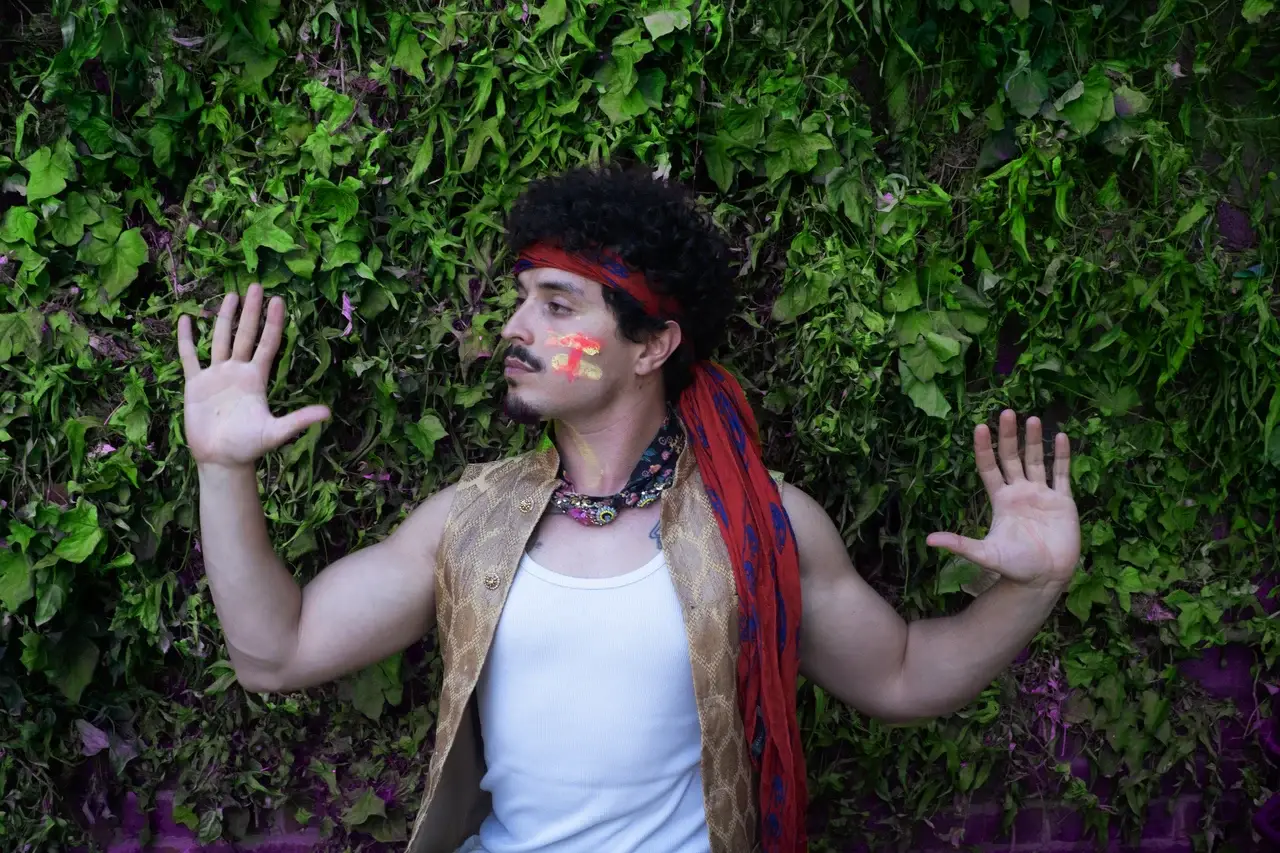 an image of musician Babymorocco. He discusses recording songs in Andy Warhol's former studio, creating pop art visuals, and developing his Tropico Rocco persona.