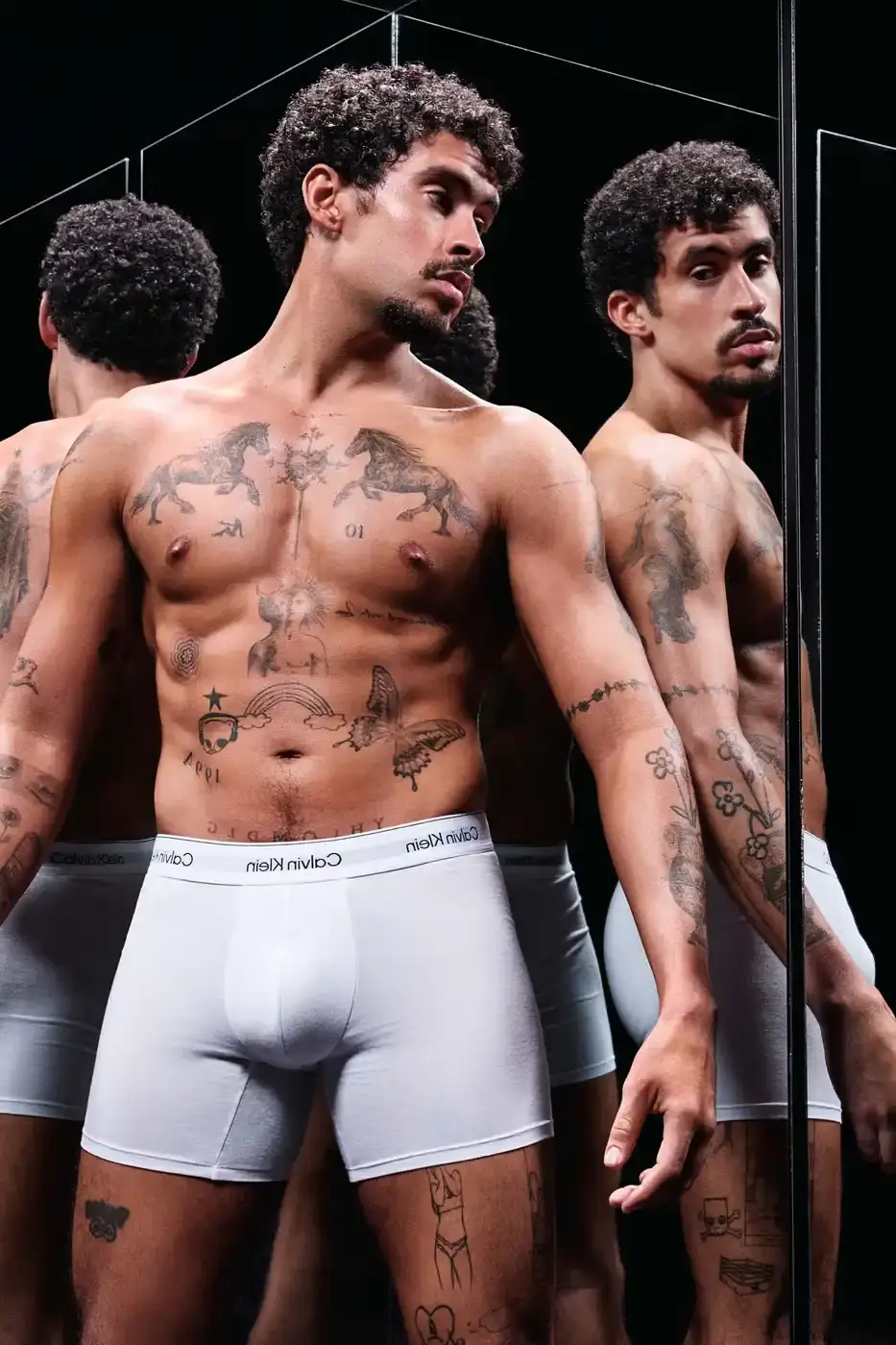 Calvin Klein Bad Bunny wearing Calvin Klein underwear from the Icon Cotton Stretch line, photographed in Puerto Rico. (image 2 of 5)