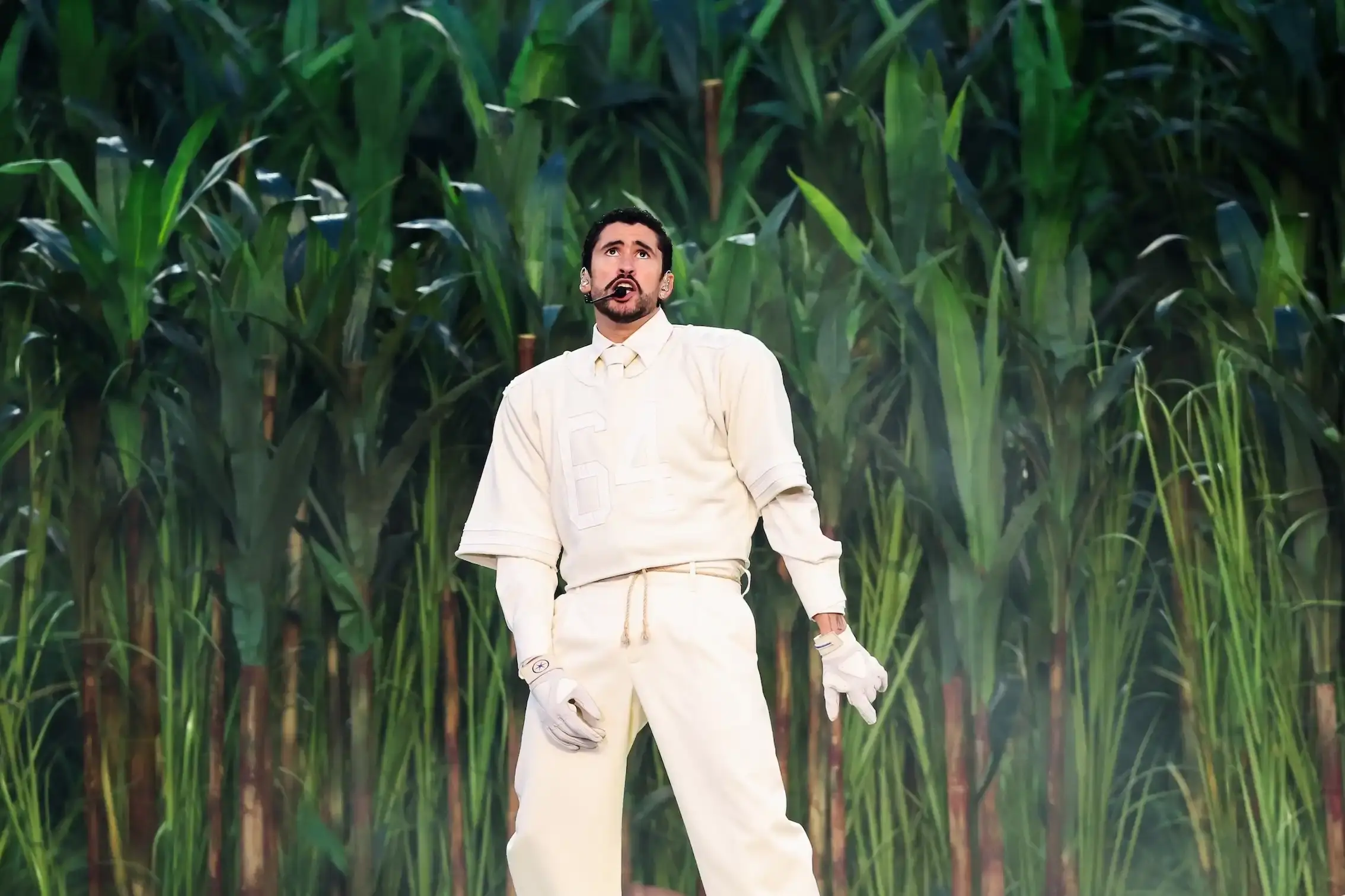 Bad Bunny performed at Super Bowl 2026 halftime show wearing a custom Zara football uniform with personal details honoring his mother, paired with adidas Badbo 1.0 sneakers.