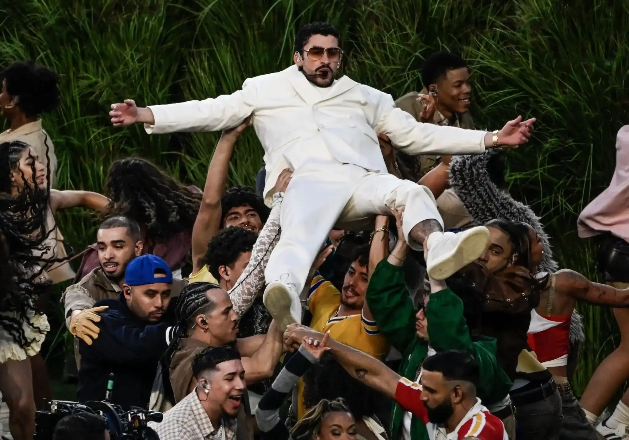 Bad Bunny performed at Super Bowl 2026 halftime show wearing a custom Zara football uniform with personal details honoring his mother, paired with adidas Badbo 1.0 sneakers. (image 2 of 2)