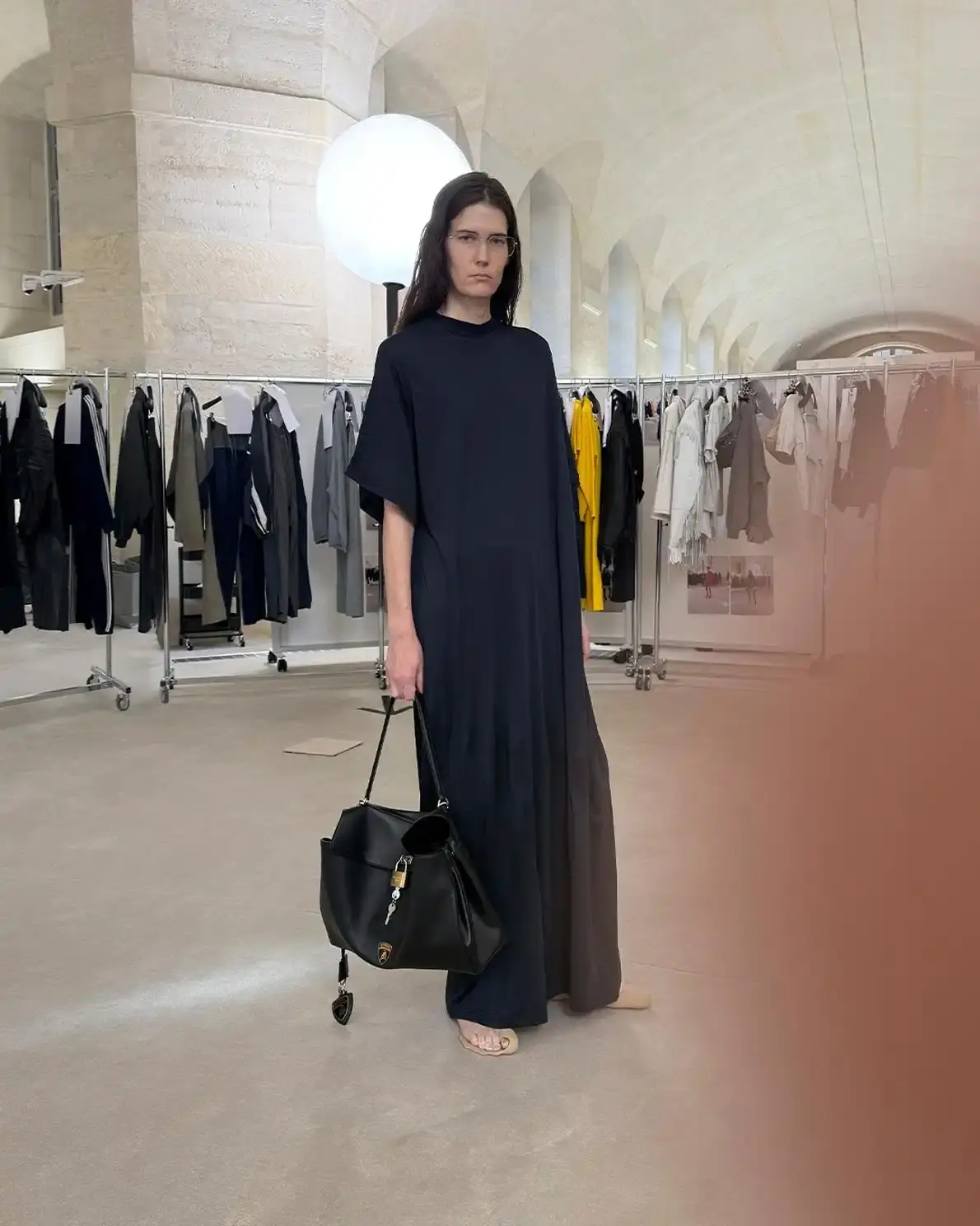 Balenciaga Fashion and automotive collaboration: Balenciaga and Lamborghini collection showcasing leather bombers, racing jackets, and reimagined iconic bags with shield logo details, highlighting aerodynamic design principles and automotive-inspired fashion.