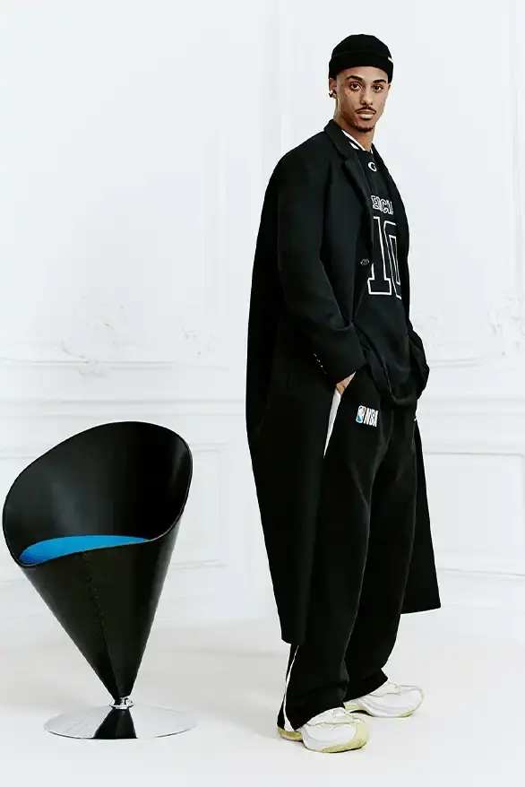 BALENCIAGA PARTNERS WITH NBA FOR FALL 2026 Balenciaga Fall 2026 collection features NBA collaboration with athletic wear, formal tailoring, and Manolo Blahnik footwear partnership under creative director Pierpaolo Piccioli. (image 33 of 52)