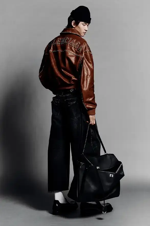 BALENCIAGA PARTNERS WITH NBA FOR FALL 2026 Balenciaga Fall 2026 collection features NBA collaboration with athletic wear, formal tailoring, and Manolo Blahnik footwear partnership under creative director Pierpaolo Piccioli. (image 35 of 52)