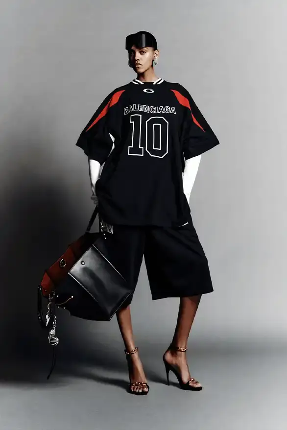 BALENCIAGA PARTNERS WITH NBA FOR FALL 2026 Balenciaga Fall 2026 collection features NBA collaboration with athletic wear, formal tailoring, and Manolo Blahnik footwear partnership under creative director Pierpaolo Piccioli. (image 14 of 52)