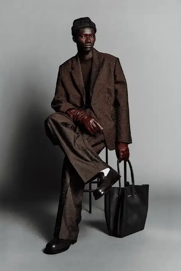 BALENCIAGA PARTNERS WITH NBA FOR FALL 2026 Balenciaga Fall 2026 collection features NBA collaboration with athletic wear, formal tailoring, and Manolo Blahnik footwear partnership under creative director Pierpaolo Piccioli. (image 5 of 52)