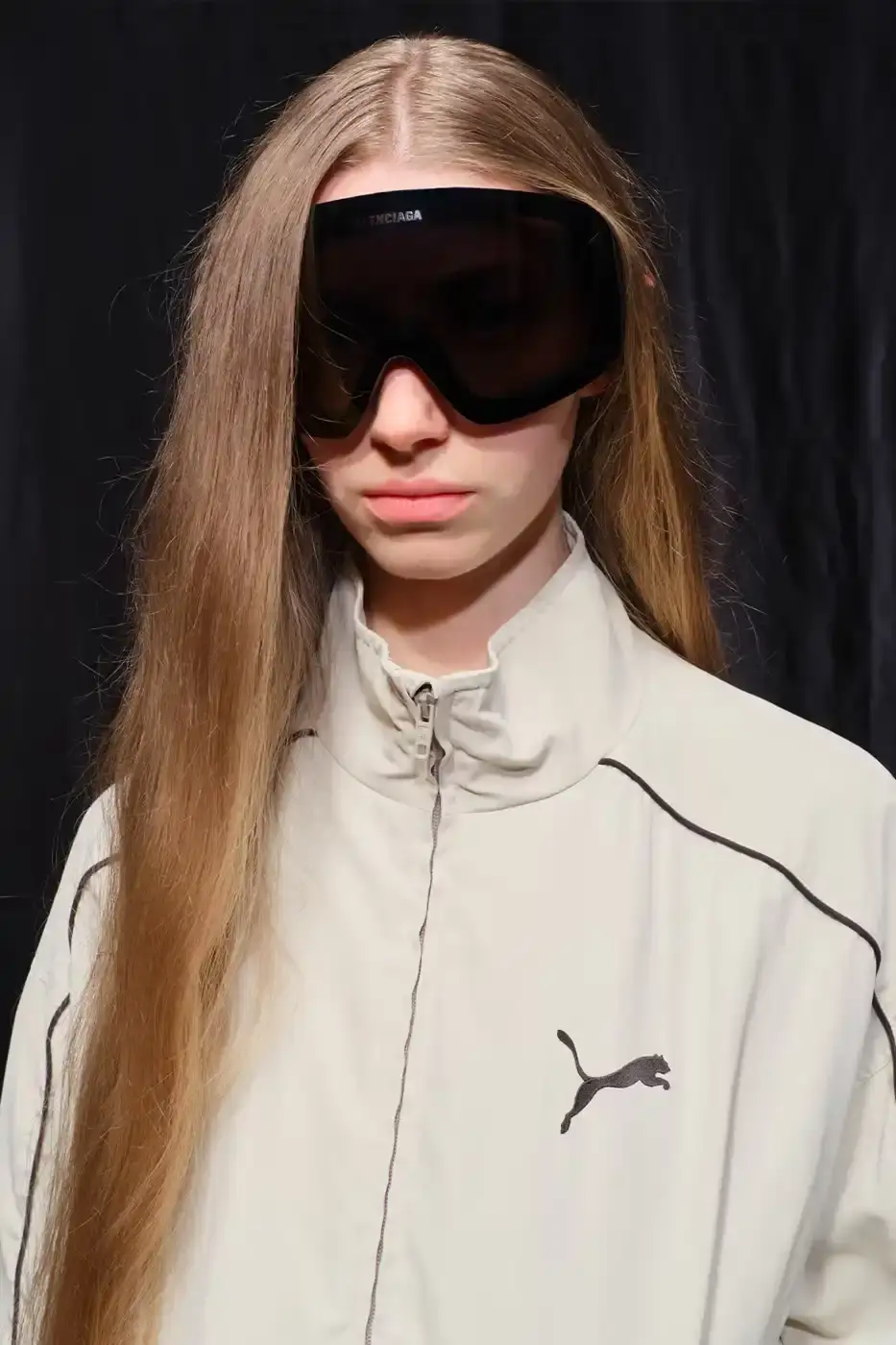 Balenciaga Balenciaga x PUMA collection display showing the Ultrasoft Speedcat sneakers in three colorways alongside tracksuits, outerwear pieces, and accessories arranged on a neutral background. (image 3 of 21)