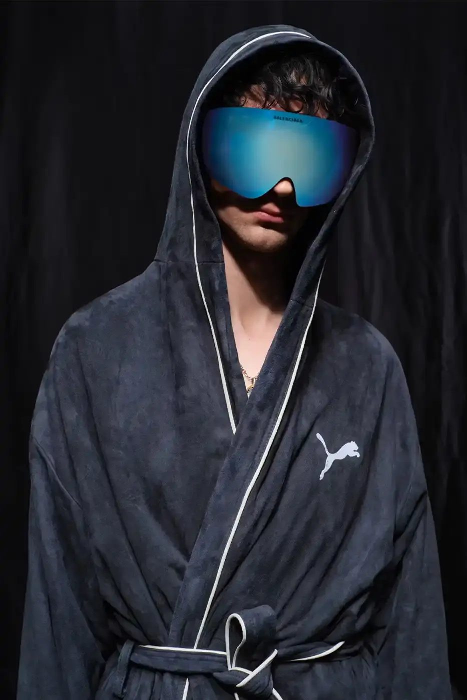 Balenciaga Balenciaga x PUMA collection display showing the Ultrasoft Speedcat sneakers in three colorways alongside tracksuits, outerwear pieces, and accessories arranged on a neutral background. (image 9 of 21)