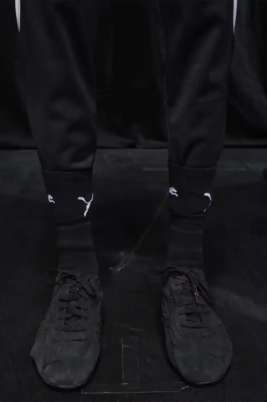 Balenciaga Balenciaga x PUMA collection display showing the Ultrasoft Speedcat sneakers in three colorways alongside tracksuits, outerwear pieces, and accessories arranged on a neutral background. (image 16 of 21)