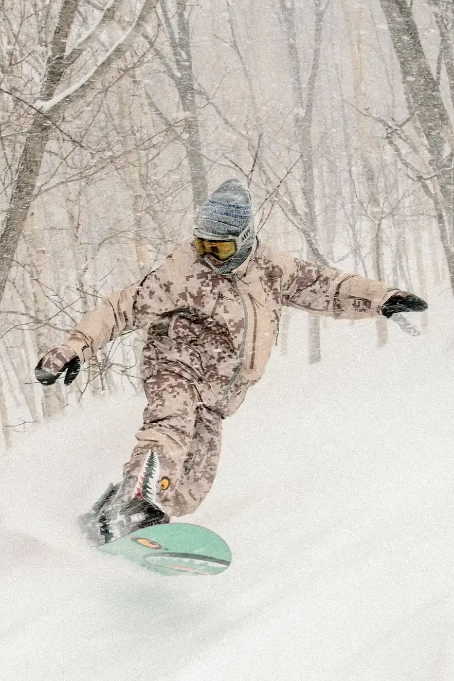 BAPE RELEASES FINAL PAW WINTER COLLECTION BAPE releases third Performance All Weather collection featuring technical snowboard jackets, overalls, and accessories with new camouflage patterns designed for extreme winter conditions. (image 8 of 24)