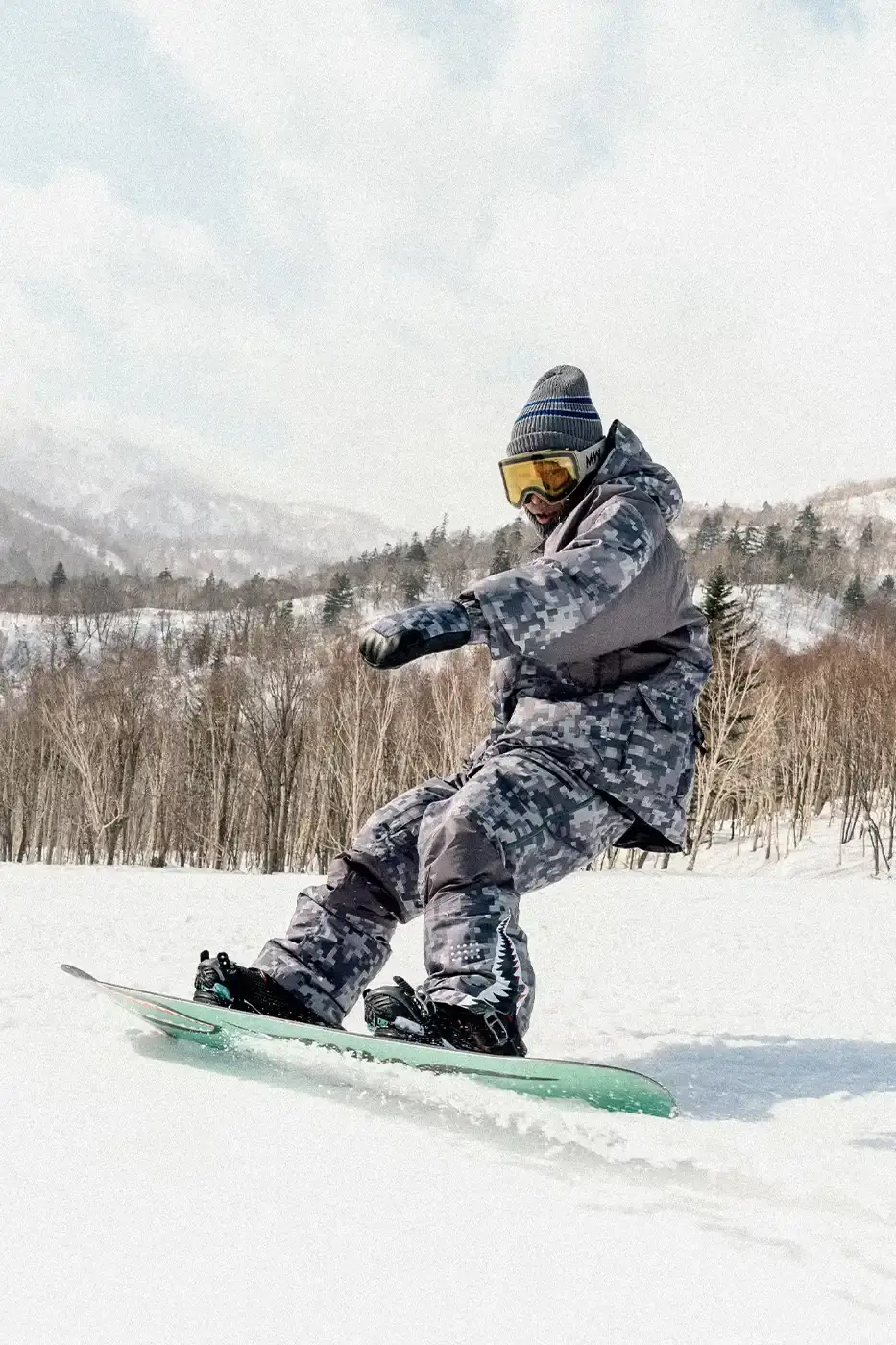 BAPE RELEASES FINAL PAW WINTER COLLECTION BAPE releases third Performance All Weather collection featuring technical snowboard jackets, overalls, and accessories with new camouflage patterns designed for extreme winter conditions. (image 3 of 24)