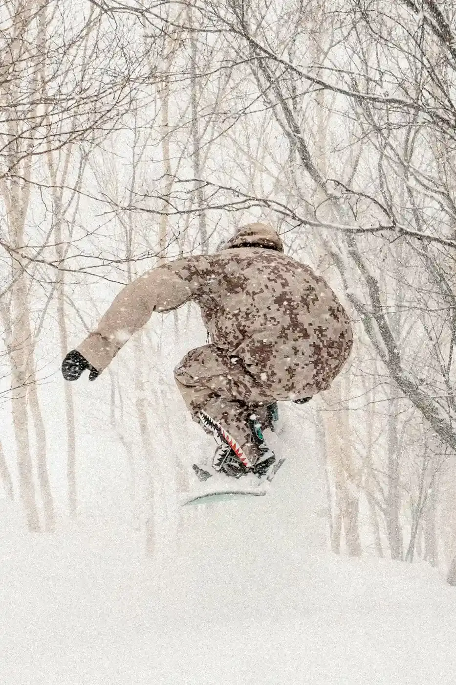 BAPE RELEASES FINAL PAW WINTER COLLECTION BAPE releases third Performance All Weather collection featuring technical snowboard jackets, overalls, and accessories with new camouflage patterns designed for extreme winter conditions. (image 7 of 24)