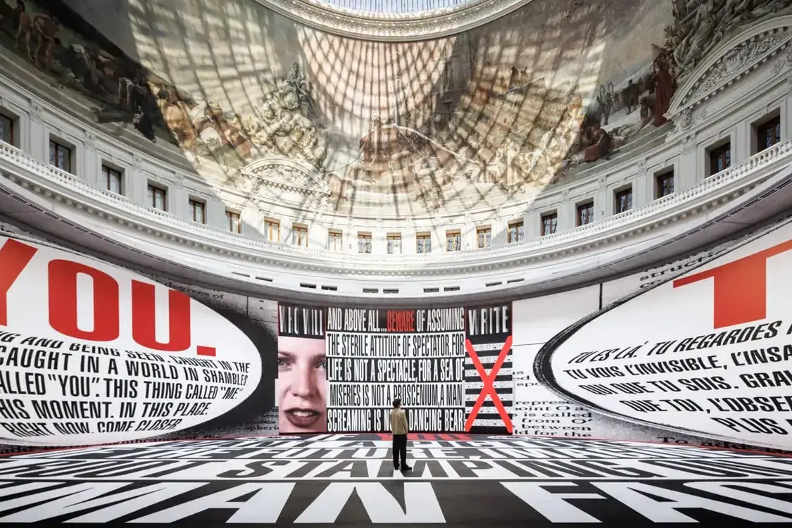 BARBARA KRUGER FILLS BOURSE DE COMMERCE ROTUNDA image about Barbara Kruger's installation The History of Tears in the Bourse de Commerce in Paris, with details on its text, light boxes, and the companion photography exhibition Remember Me.