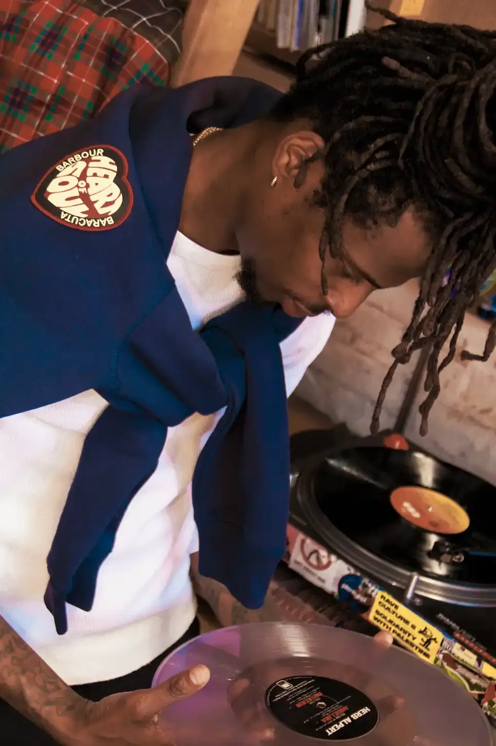 BARBOUR AND BARACUTA UNITE FOR NORTHERN SOUL COLLECTION Barbour and Baracuta release their third collaborative collection for Autumn Winter 2025, featuring outerwear and accessories inspired by Northern Soul culture and shot by photographer Normski. (image 6 of 6)