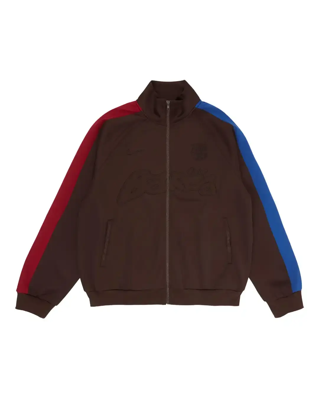 FC BARCELONA AND TRAVIS SCOTT TEAM UP FOR LIMITED COLLECTION image of the collaboration between FC Barcelona and Travis Scott, facilitated by Spotify. It details how the rapper designed a special kit featuring his Cactus Jack logo for the upcoming El Clásico match against Real Madrid on May 11. The article includes a quote from Scott about the partnership and describes the merchandise collection, which includes Nike-branded apparel with vintage-style acid washing. The collection continues Barcelona's tradition of featuring musical artists on special match kits through their Spotify partnership. (image 7 of 14)