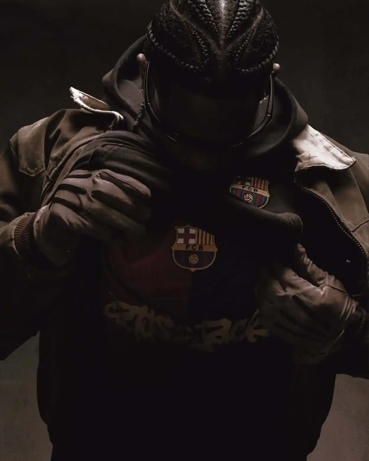 FC BARCELONA AND TRAVIS SCOTT TEAM UP FOR LIMITED COLLECTION image of the collaboration between FC Barcelona and Travis Scott, facilitated by Spotify. It details how the rapper designed a special kit featuring his Cactus Jack logo for the upcoming El Clásico match against Real Madrid on May 11. The article includes a quote from Scott about the partnership and describes the merchandise collection, which includes Nike-branded apparel with vintage-style acid washing. The collection continues Barcelona's tradition of featuring musical artists on special match kits through their Spotify partnership. (image 11 of 14)