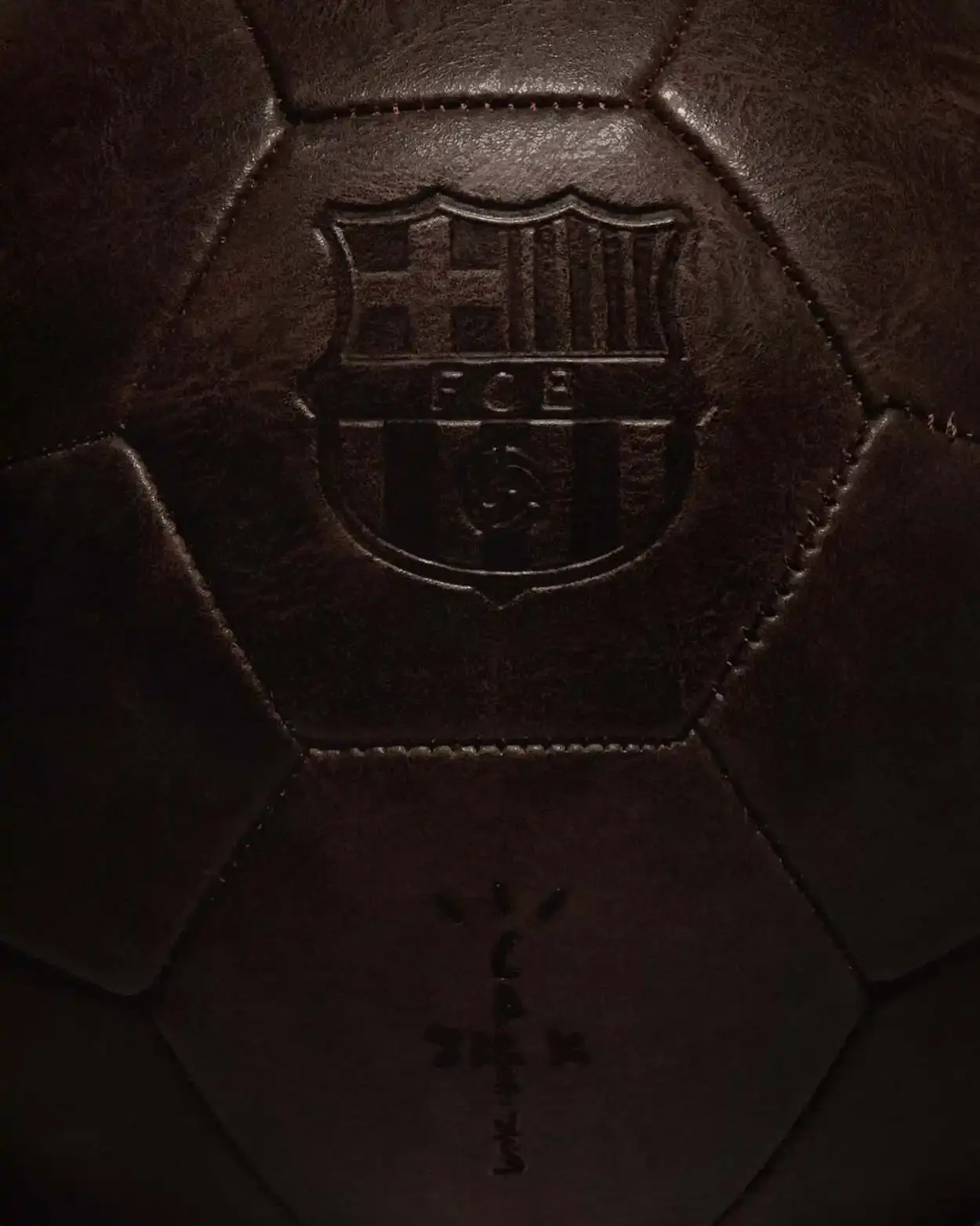 FC BARCELONA AND TRAVIS SCOTT TEAM UP FOR LIMITED COLLECTION image of the collaboration between FC Barcelona and Travis Scott, facilitated by Spotify. It details how the rapper designed a special kit featuring his Cactus Jack logo for the upcoming El Clásico match against Real Madrid on May 11. The article includes a quote from Scott about the partnership and describes the merchandise collection, which includes Nike-branded apparel with vintage-style acid washing. The collection continues Barcelona's tradition of featuring musical artists on special match kits through their Spotify partnership. (image 13 of 14)