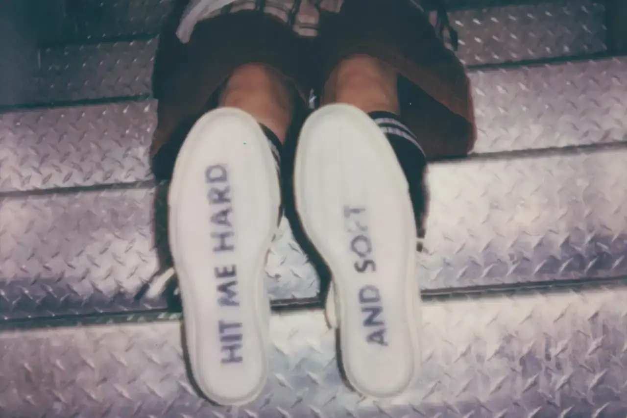 BILLIE EILISH COLLABORATES WITH CONVERSE ON CUSTOMIZABLE SNEAKER LINE Billie Eilish partners with Converse to launch a customizable sneaker line featuring personalized Chuck Taylor All Star and Chuck Taylor Lift Platform models. The collection includes ice-blue transparent soles with Eilish's album name, options to add song lyrics to midsoles, and various design elements like embroidered mascots and colored stars. Available exclusively on Converse's website, this collaboration offers fans a unique way to express themselves through personalized footwear inspired by Eilish's music and style. (image 7 of 7)