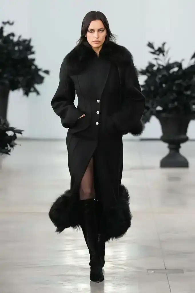 Blumarine - Fall-Winter2025 - 2026 - Womenswear - Italie - Milan - ©Launchmetrics/spotlight Models walking the runway at David Koma's debut Blumarine autumn/winter 2025 collection, showcasing sculptural neoprene pieces and bustier dresses in a palette of red, black, gray, and white against a minimalist backdrop at Milan Fashion Week.