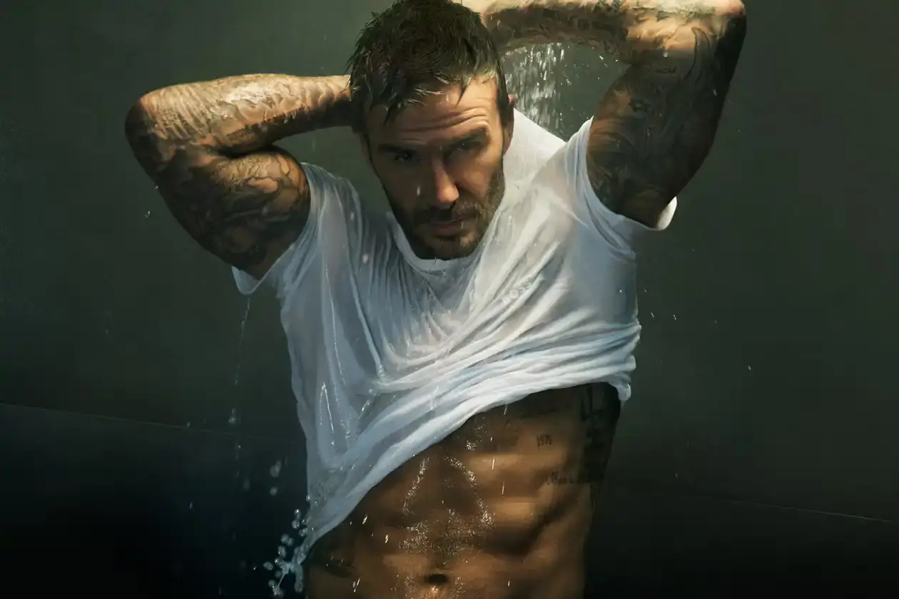 Boss David Beckham wearing white BOSS ONE boxer briefs while seated in a minimalist New York apartment, photographed in black and white (image 4 of 5)