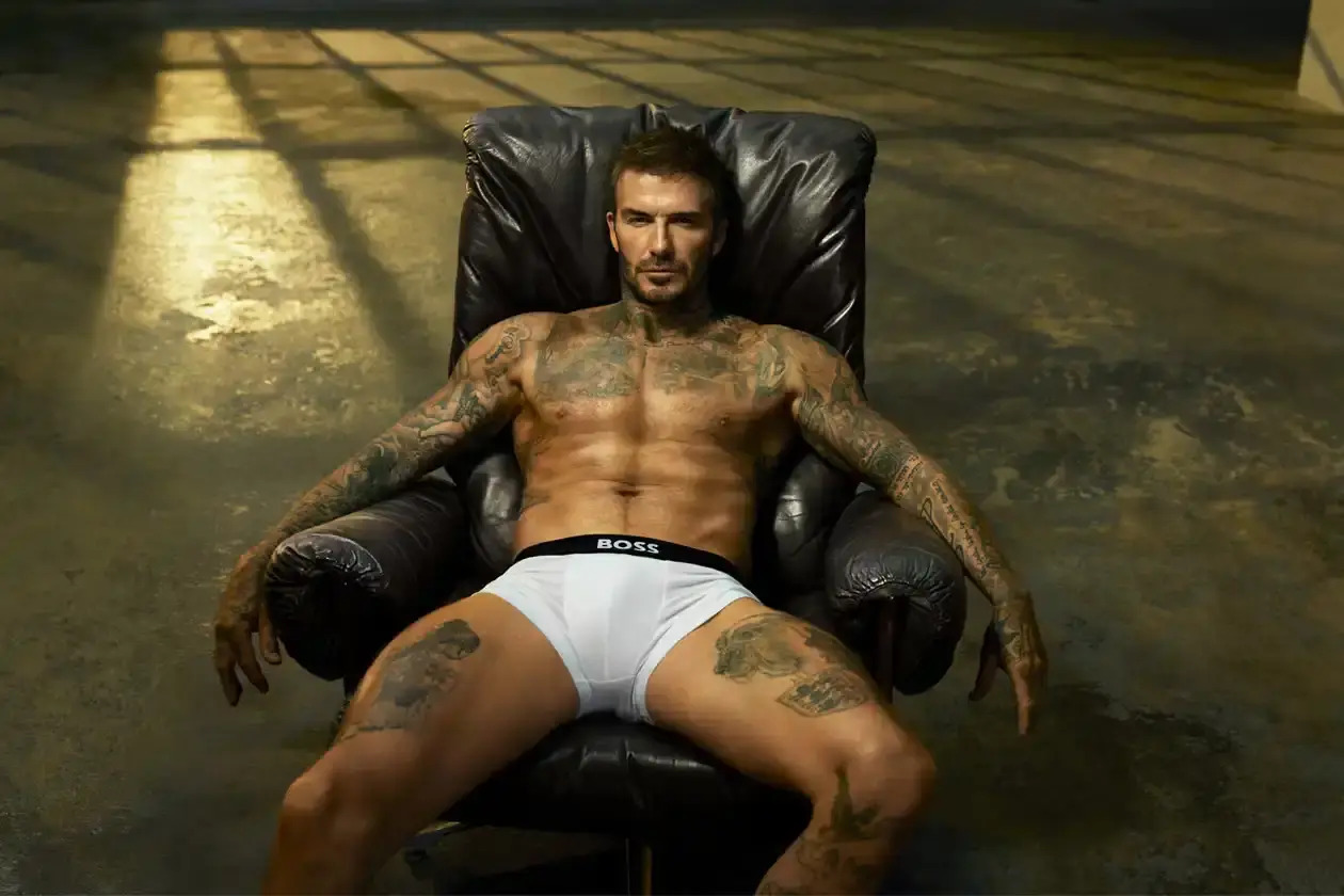 Boss David Beckham wearing white BOSS ONE boxer briefs while seated in a minimalist New York apartment, photographed in black and white (image 3 of 5)