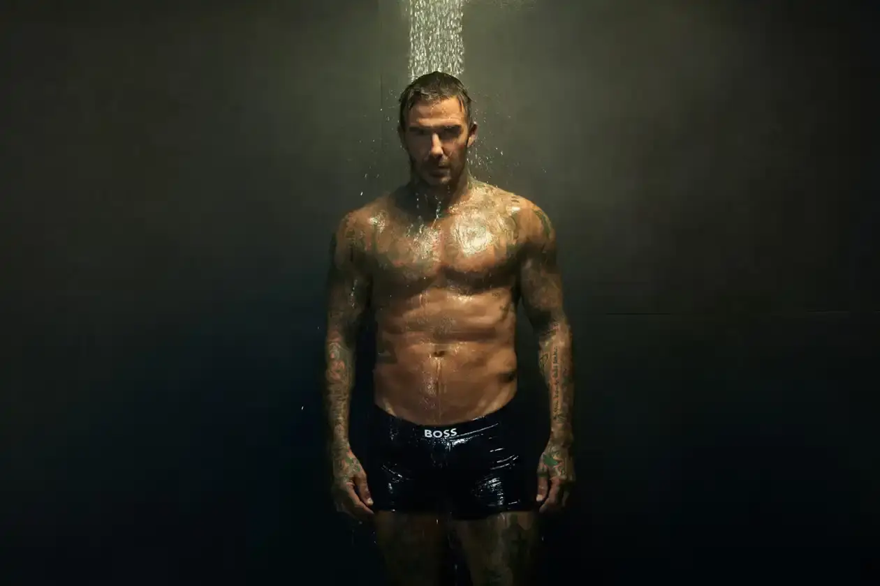 Boss David Beckham wearing white BOSS ONE boxer briefs while seated in a minimalist New York apartment, photographed in black and white (image 5 of 5)