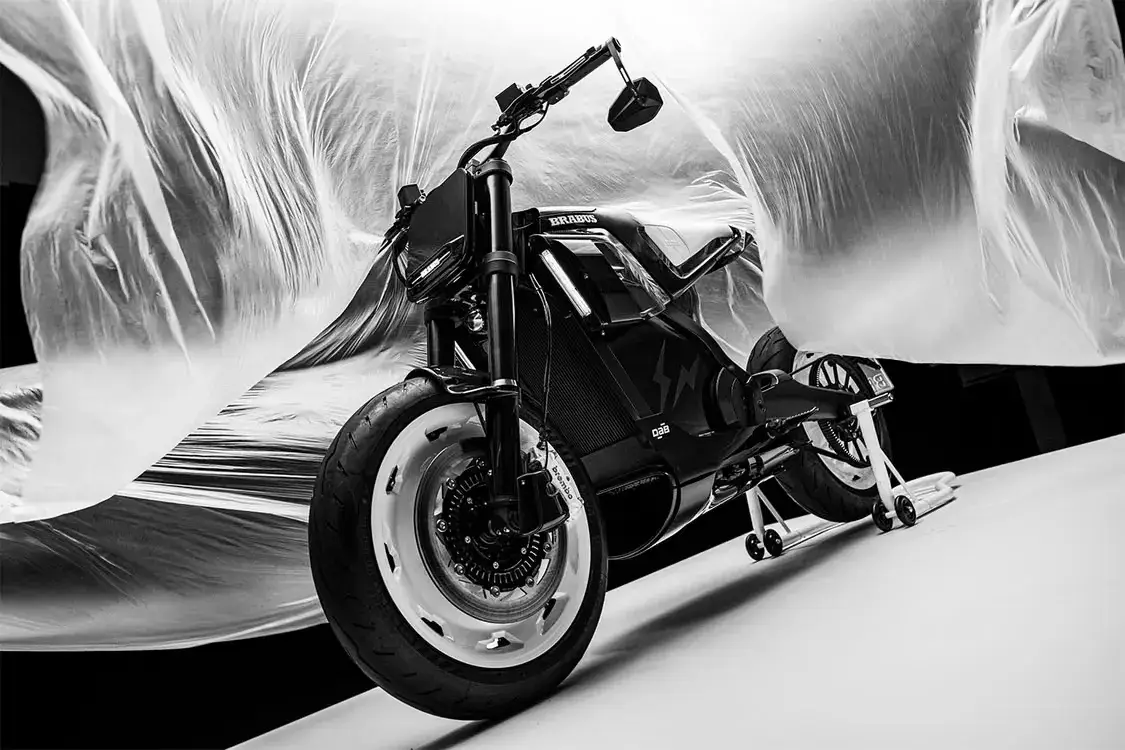 BRABUS URBAN E FRAGMENT EDITION LIMITED TO 10 UNITS image about the Brabus Urban E Fragment Edition, an electric motorcycle in black and white designed with Hiroshi Fujiwara and built by DAB Motors in a run of 10 units. It covers the design changes, unchanged specifications and price.