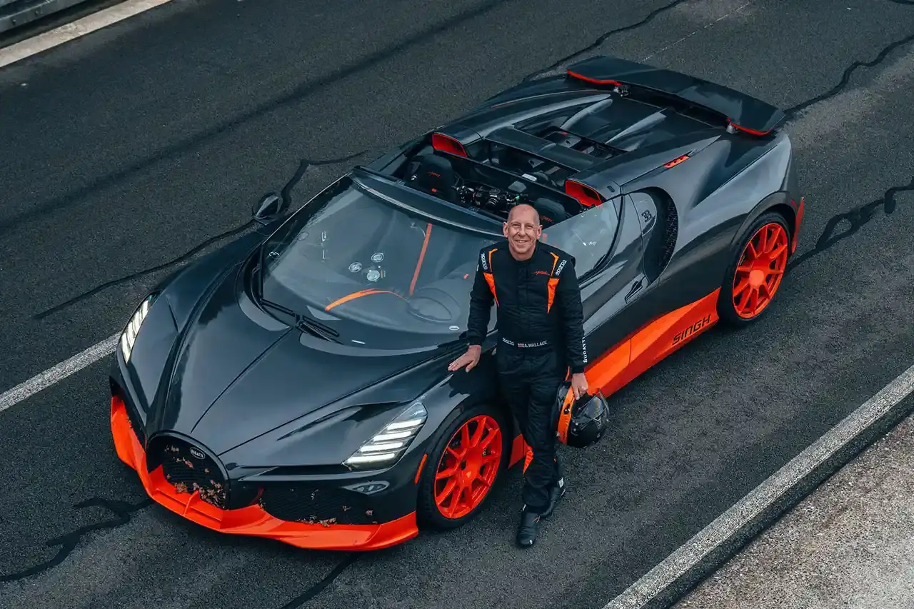 Bugatti Bugatti, the renowned manufacturer of high-performance luxury automobiles, has once again pushed the boundaries of automotive engineering with the remarkable achievements of its W16 Mistral model. On November 9th, the W16 Mistral set a new world record for the fastest open-top car, reaching a staggering speed of 453.91 km/h (281 mph) at the ATP Automotive Testing Papenburg track in Germany. The record-breaking run was piloted by Andy Wallace, Bugatti's official test driver and a renowned Le Mans winner, showcasing the exceptional capabilities of the W16 Mistral. This remarkable feat builds upon Bugatti's legacy of record-setting performance, including the Veyron 16.4 Grand Sport Vitesse's 408.84 km/h (253 mph) record achieved in 2013 and the Chiron Super Sport 300+'s 490.48 km/h (304 mph) closed-cockpit record set in 2019. The W16 Mistral, a bespoke $14.8 million USD model, features a striking black carbon body with "Jet Orange" accents, paying homage to Bugatti's previous record-setting vehicles. The event was attended by Mate Rimac, CEO of Bugatti Rimac, as well as Bugatti's senior team and the vehicle's owner, a collector from Punjab, India. Highlighting the W16 Mistral's prowess, the owner had the opportunity to experience the car's remarkable speed firsthand, joining Wallace for a high-speed run. This latest addition to The Singh Collection joins an exclusive lineup of Bugatti's record-breaking automobiles. (image 8 of 12)