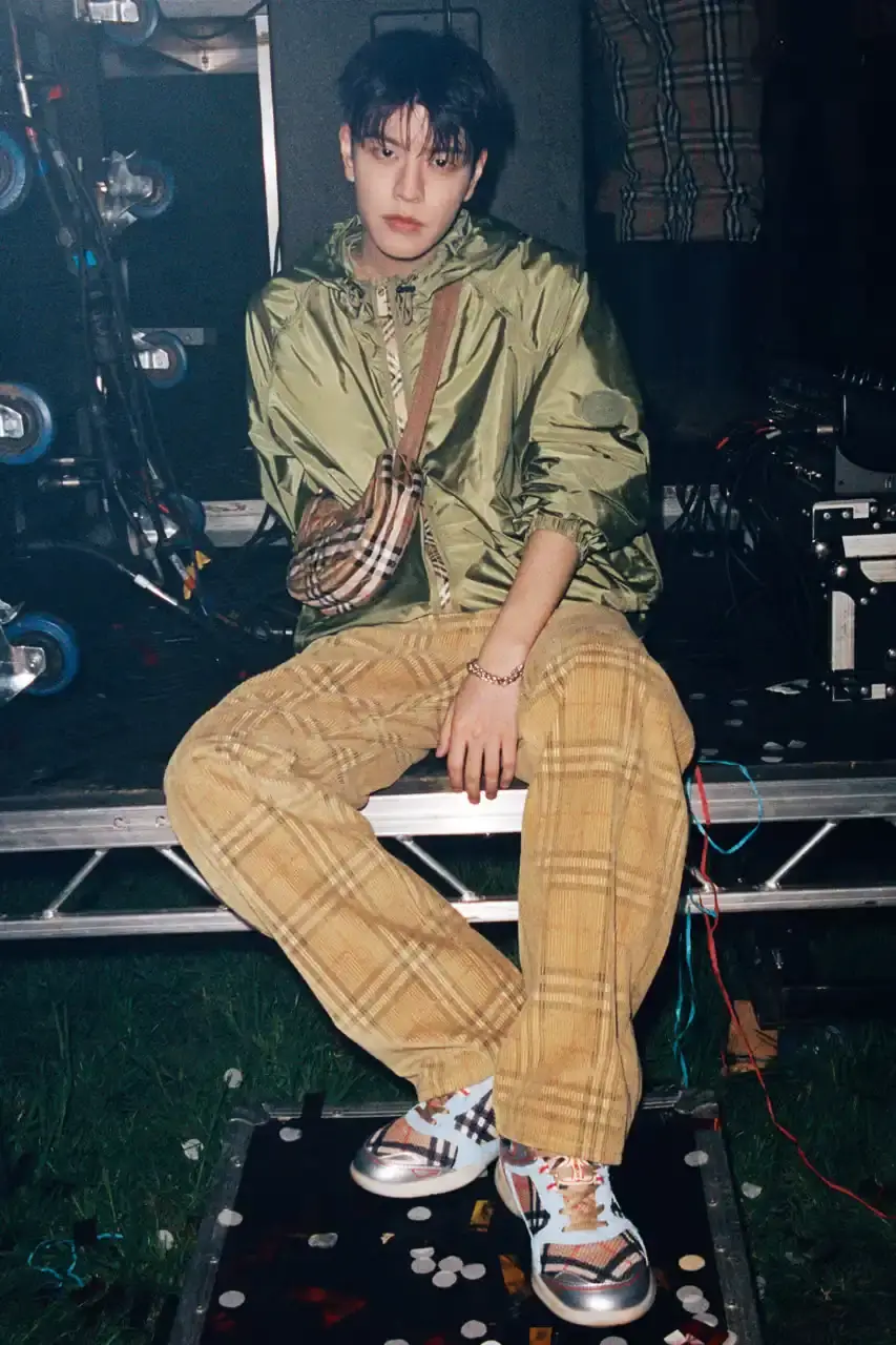 BURBERRY DROPS FESTIVAL COLLECTION FOR WEATHER EXTREMES image about Burberry's festival clothing collection designed for variable weather conditions. Covers campaign featuring multiple celebrities, product details including waterproof and lightweight options, and practical festival footwear. Content includes product descriptions, campaign visuals explanation, and shopping information for festival-goers seeking luxury outdoor wear. (image 30 of 31)