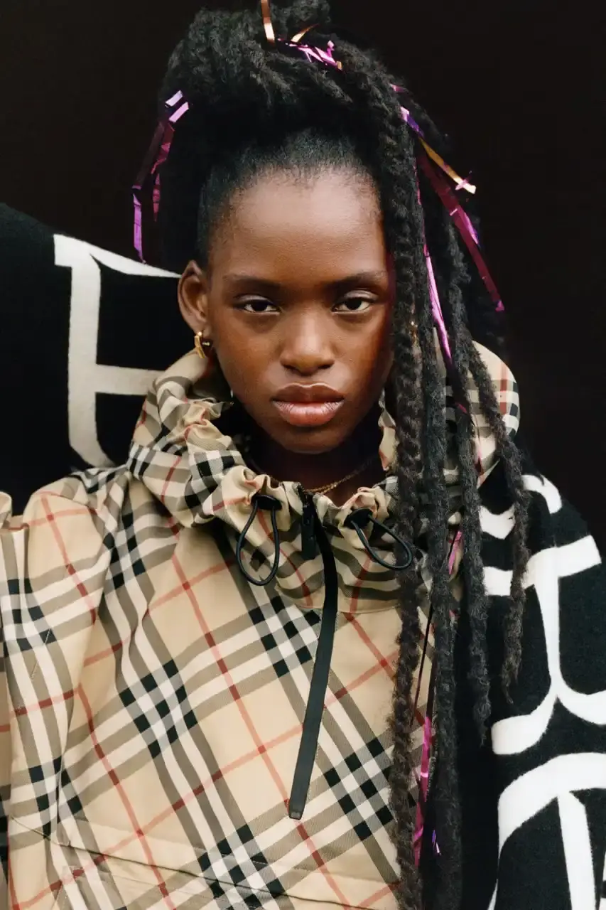 BURBERRY DROPS FESTIVAL COLLECTION FOR WEATHER EXTREMES image about Burberry's festival clothing collection designed for variable weather conditions. Covers campaign featuring multiple celebrities, product details including waterproof and lightweight options, and practical festival footwear. Content includes product descriptions, campaign visuals explanation, and shopping information for festival-goers seeking luxury outdoor wear. (image 6 of 31)