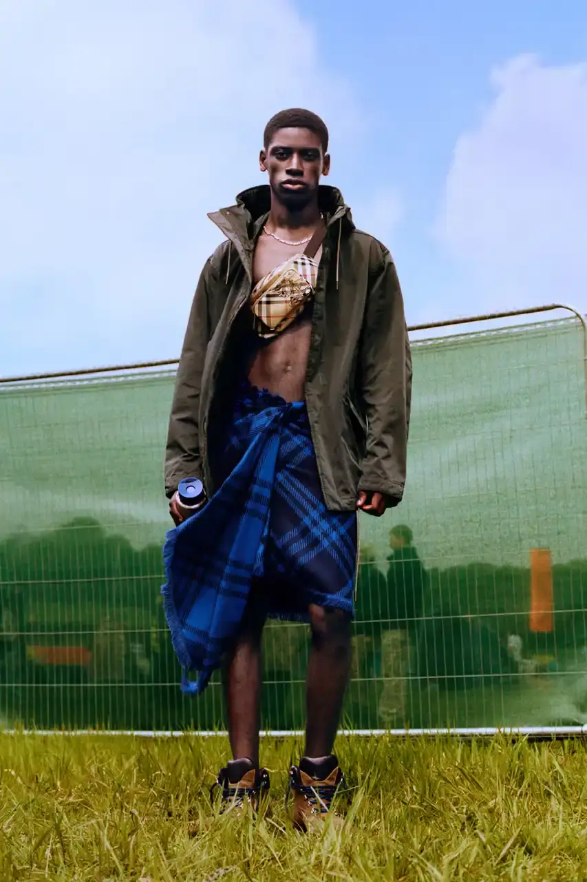BURBERRY DROPS FESTIVAL COLLECTION FOR WEATHER EXTREMES image about Burberry's festival clothing collection designed for variable weather conditions. Covers campaign featuring multiple celebrities, product details including waterproof and lightweight options, and practical festival footwear. Content includes product descriptions, campaign visuals explanation, and shopping information for festival-goers seeking luxury outdoor wear. (image 18 of 31)