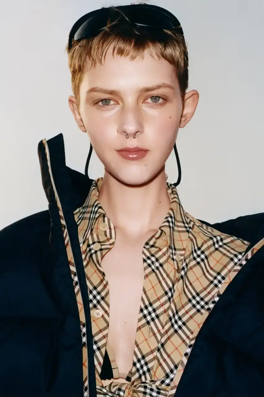 BURBERRY DROPS FESTIVAL COLLECTION FOR WEATHER EXTREMES image about Burberry's festival clothing collection designed for variable weather conditions. Covers campaign featuring multiple celebrities, product details including waterproof and lightweight options, and practical festival footwear. Content includes product descriptions, campaign visuals explanation, and shopping information for festival-goers seeking luxury outdoor wear. (image 8 of 31)
