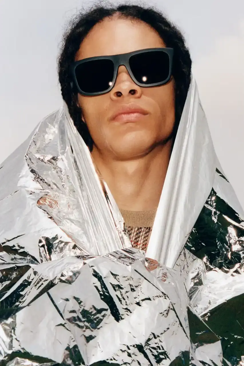 BURBERRY DROPS FESTIVAL COLLECTION FOR WEATHER EXTREMES image about Burberry's festival clothing collection designed for variable weather conditions. Covers campaign featuring multiple celebrities, product details including waterproof and lightweight options, and practical festival footwear. Content includes product descriptions, campaign visuals explanation, and shopping information for festival-goers seeking luxury outdoor wear. (image 14 of 31)