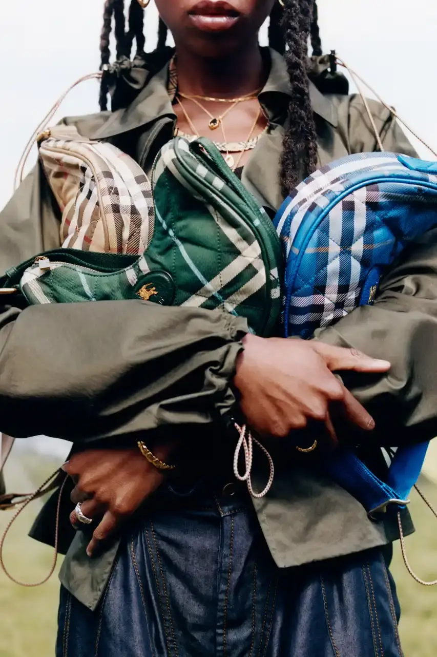 BURBERRY DROPS FESTIVAL COLLECTION FOR WEATHER EXTREMES image about Burberry's festival clothing collection designed for variable weather conditions. Covers campaign featuring multiple celebrities, product details including waterproof and lightweight options, and practical festival footwear. Content includes product descriptions, campaign visuals explanation, and shopping information for festival-goers seeking luxury outdoor wear. (image 3 of 31)