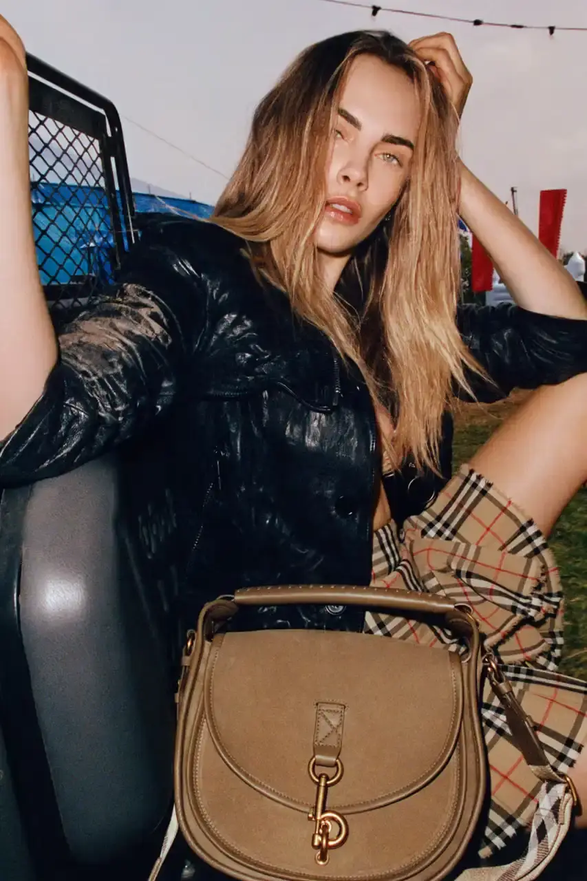 BURBERRY DROPS FESTIVAL COLLECTION FOR WEATHER EXTREMES image about Burberry's festival clothing collection designed for variable weather conditions. Covers campaign featuring multiple celebrities, product details including waterproof and lightweight options, and practical festival footwear. Content includes product descriptions, campaign visuals explanation, and shopping information for festival-goers seeking luxury outdoor wear. (image 7 of 31)