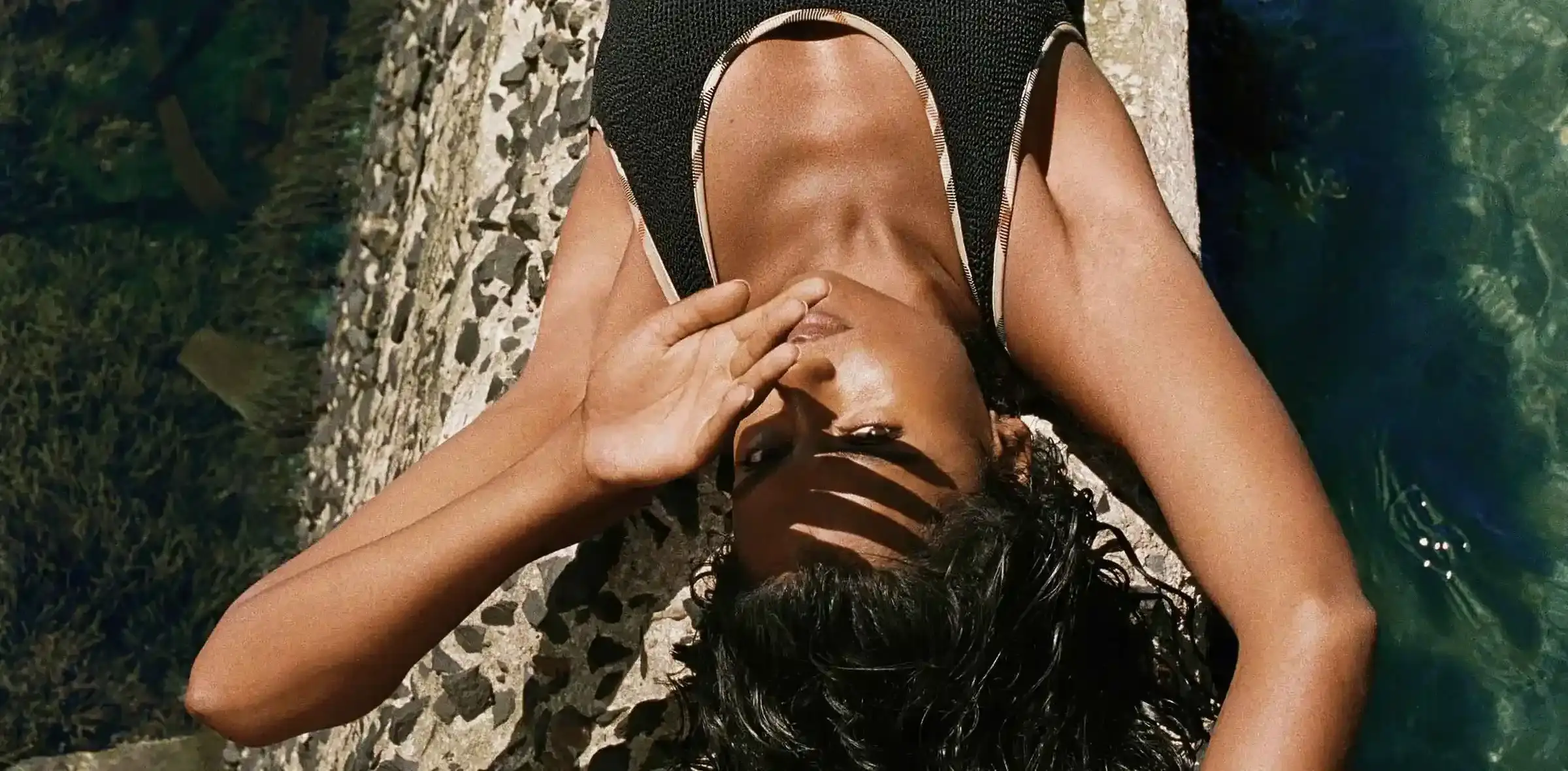 BURBERRY AND HUNZA G RELEASE ONE SIZE SWIMWEAR This image details a clothing collaboration between Burberry and Hunza G focusing on single size swimwear.