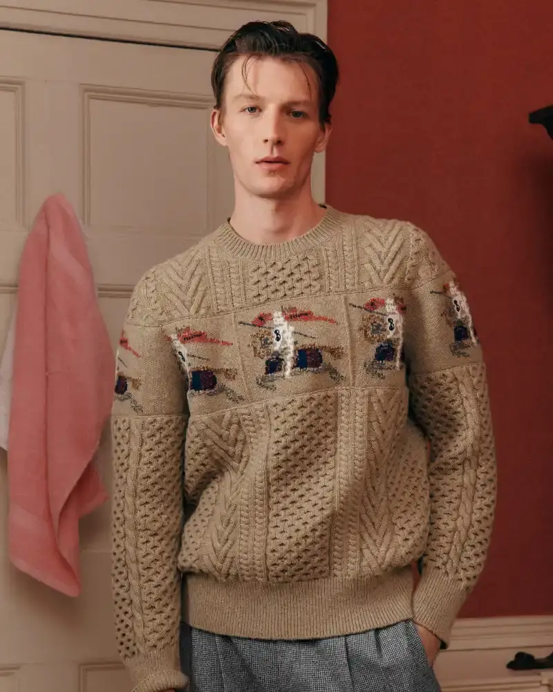 BURBERRY RETURNS TO HOUSE CODES FOR SPRING 2026 Article reviewing Burberry's Spring 2026 menswear collection, featuring heritage-inspired pieces including trench coats, knitwear, and accessories with signature house patterns. (image 9 of 19)