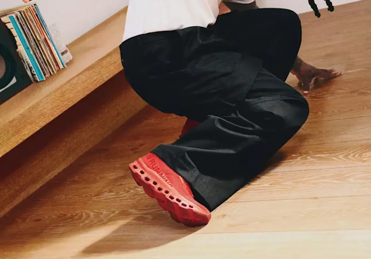 BURNA BOY AND ON RELEASE FIRST SNEAKER COLLECTION image about the first footwear collection from On and Burna Boy. It covers the all-red Cloudmonster BB, the white THE ROGER Clubhouse BB, prices in dollars and euros, the campaign and where to buy. (image 2 of 15)