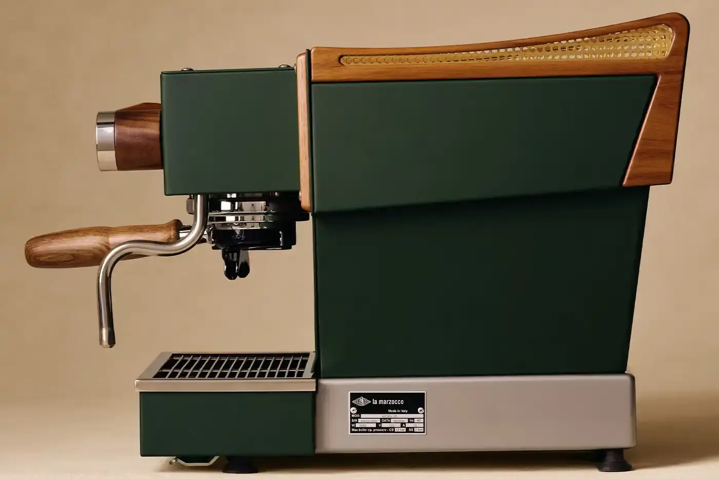 CAFÉ LEON DORE PARTNERS WITH LA MARZOCCO ON EXCLUSIVE COFFEE COLLECTION Image of the collaboration between Café Leon Dore (part of Aimé Leon Dore) and La Marzocco. The partnership features a custom-designed Linea Micra espresso machine in green with brass and walnut details, plus co-branded apparel including aprons, t-shirts, and hats. The collection is available exclusively through Aimé Leon Dore's stores and website. The article provides details about the machine's professional capabilities despite its compact size, and notes that it's being produced in limited quantities. (image 4 of 6)