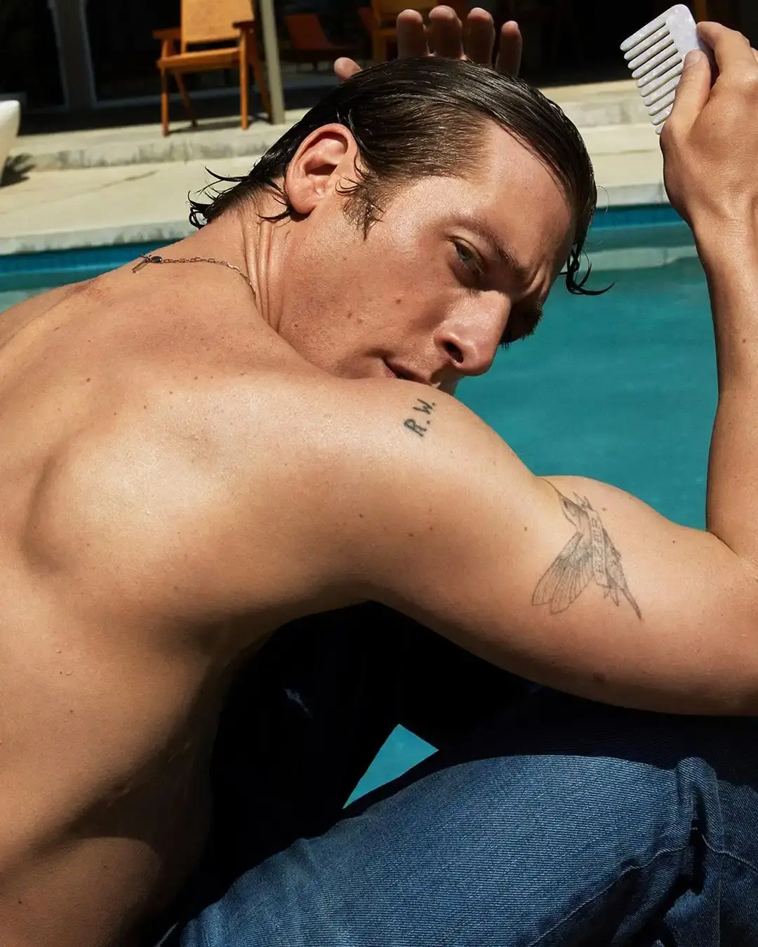 Jeremy Allen White combs his hair in Calvin Klein campaign