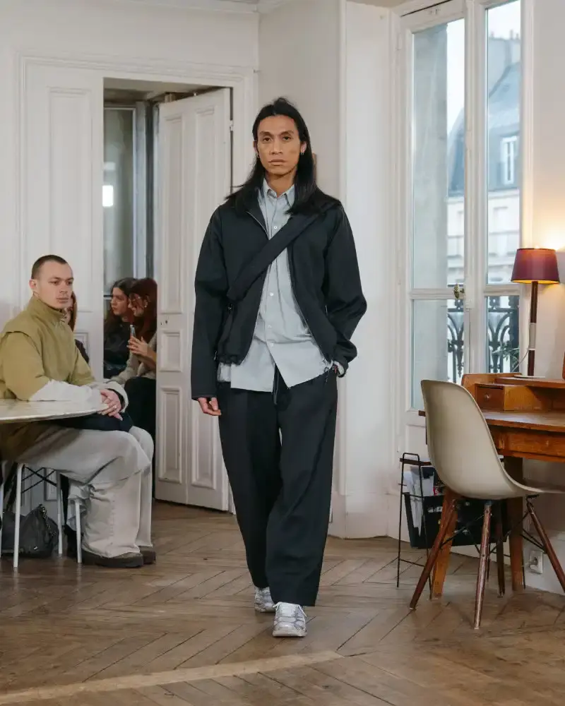 CAMIEL FORTGENS REWORKS DOMESTIC MATERIALS FOR FW26 Camiel Fortgens Fall/Winter 2026 collection shown in Paris apartment, featuring garments made from domestic materials like curtain pleats and sofa leather in earthy tones. (image 15 of 19)