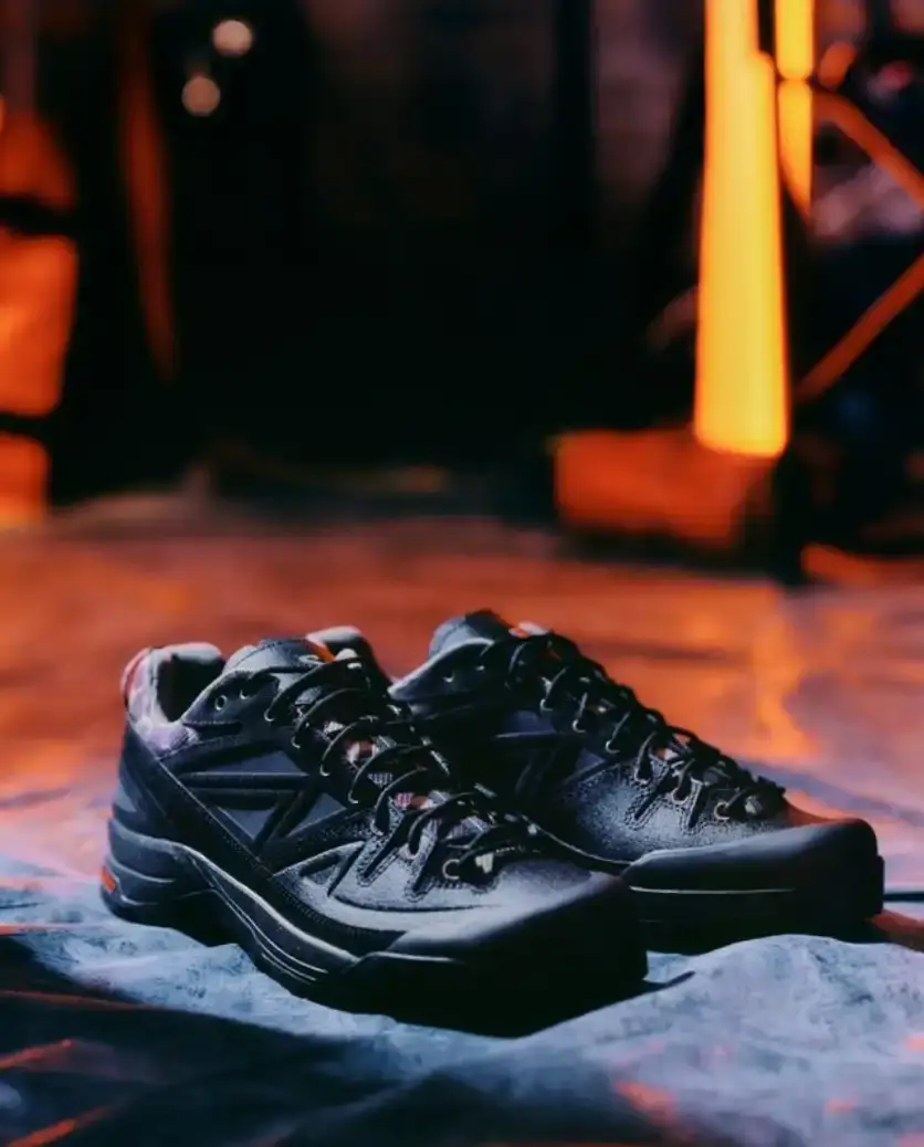 CARHARTT WIP AND SALOMON RELEASE X-ALP SNEAKER Carhartt WIP and Salomon collaborate on the X-ALP sneaker, featuring black leather upper with suede layers and camouflage details, releasing December 18. (image 2 of 6)