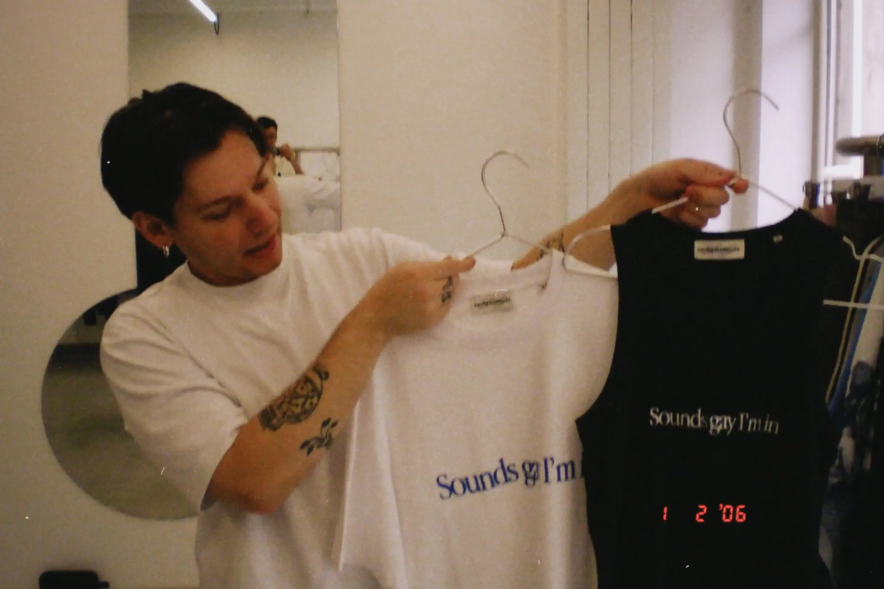 image of Carne Bollente's Spring/Summer 2026 collection "Give Me a Break," featuring sex-positive streetwear designs, collaboration with Japanese artist Sadao Hasegawa, and pieces inspired by European travel culture. The collection includes graphic tees, denim, and accessories that blend eroticism with everyday wear, presented during Paris Fashion Week. (image 2 of 3)