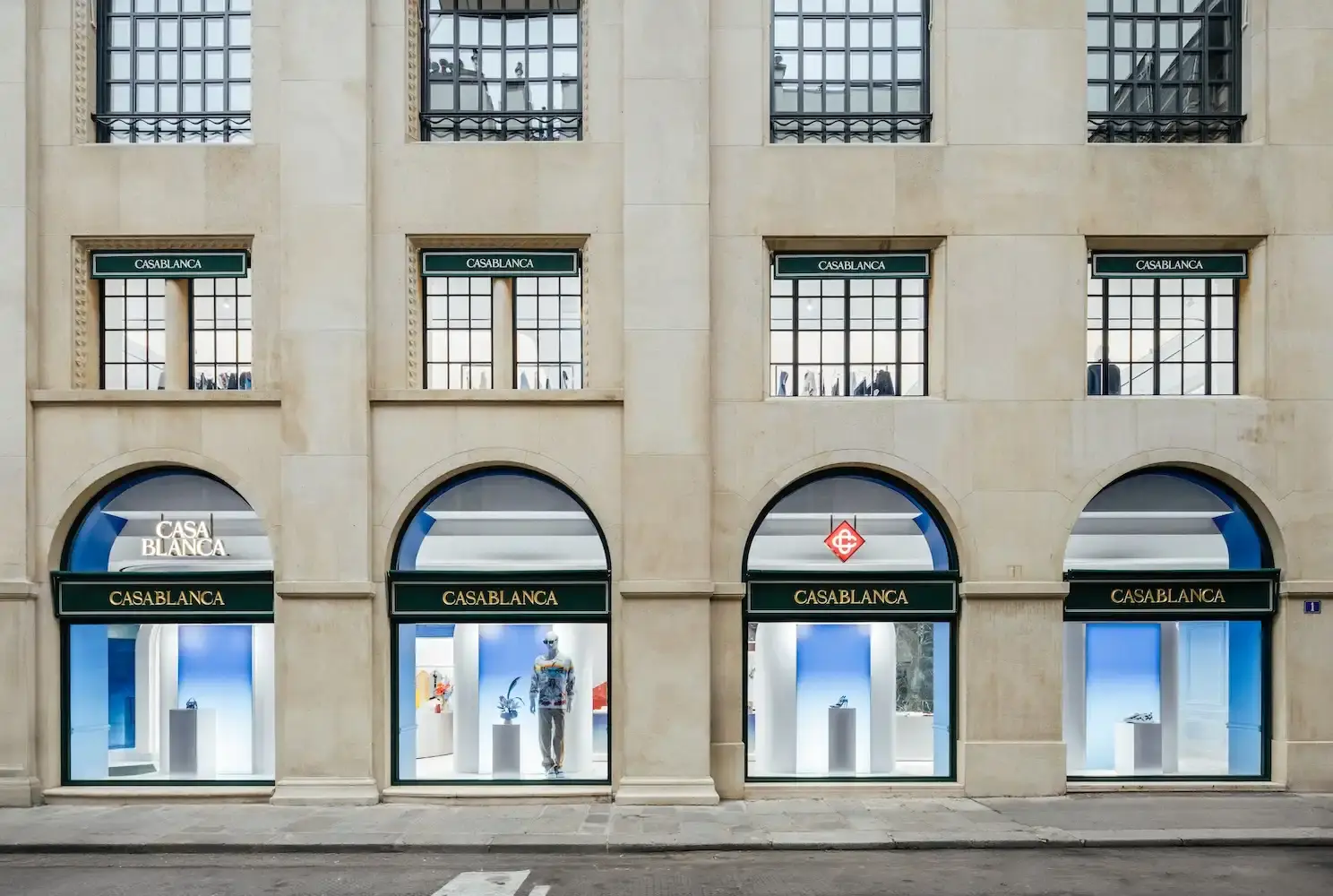 CASABLANCA OPENS FIRST PARIS FLAGSHIP STORE image of Fashion brand Casablanca has opened its first flagship store in Paris on the prestigious Rue du Faubourg Saint-Honoré. The three-floor boutique features Haussmannian architecture with design elements inspired by tennis courts, ancient Greece, and futurism. For founder Charaf Tajer, who grew up in Paris's Belleville district, the opening represents a meaningful homecoming and milestone for the luxury streetwear brand.