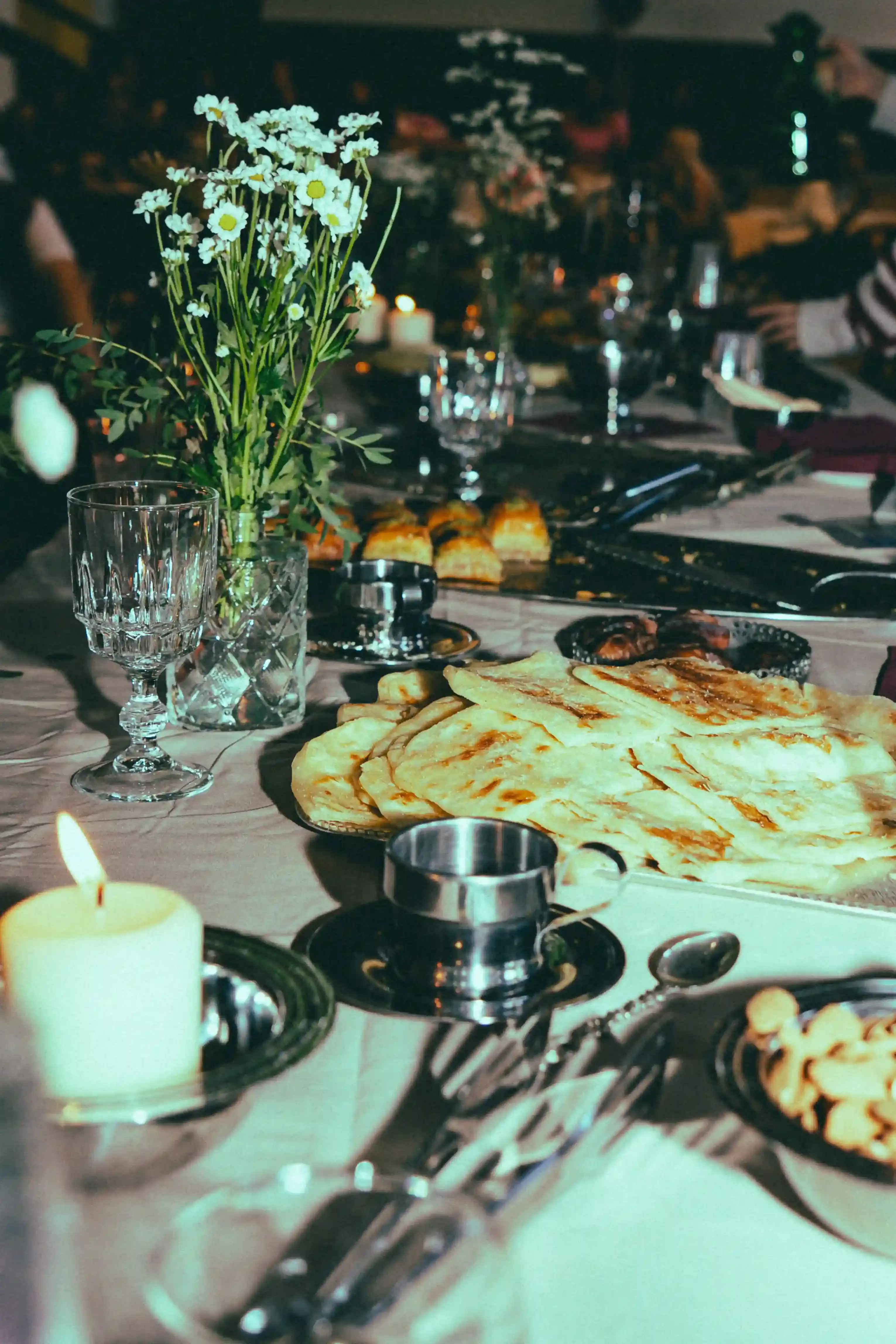 CASAWI & DARNA: MOROCCAN BRUNCH MEETS SWANA CINEMA IN MILAN image photographed by Alioune Gueye about a cultural event in Milan where fashion brand Casawi partnered with film festival Darna to host a Moroccan brunch followed by screenings of films from South West Asia and North Africa. The event brought together Milan's fashion and art community to emphasize authentic cultural connection over commercial spectacle, featuring traditional foods like Tunisian tea and fostering dialogue about identity and belonging through cinema. (image 3 of 16)