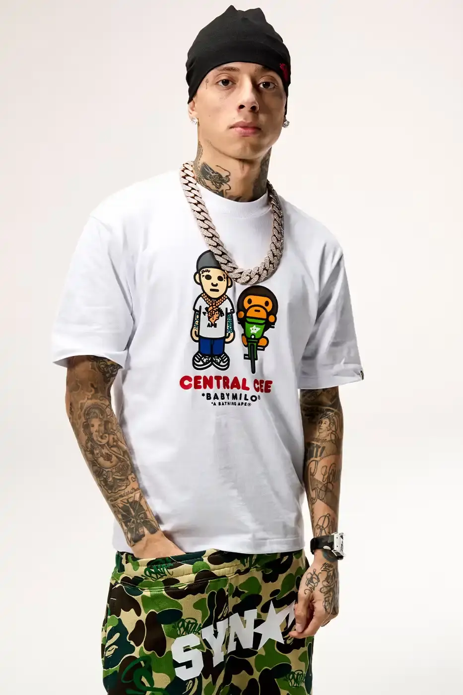 CENTRAL CEE DIRECTS BAPE SPOTIFY COLLECTION Central Cee BAPE Spotify SYNA collaboration streetwear collection featuring purple puffer jacket, football jersey, and graphic tees releasing November 25 (image 5 of 10)
