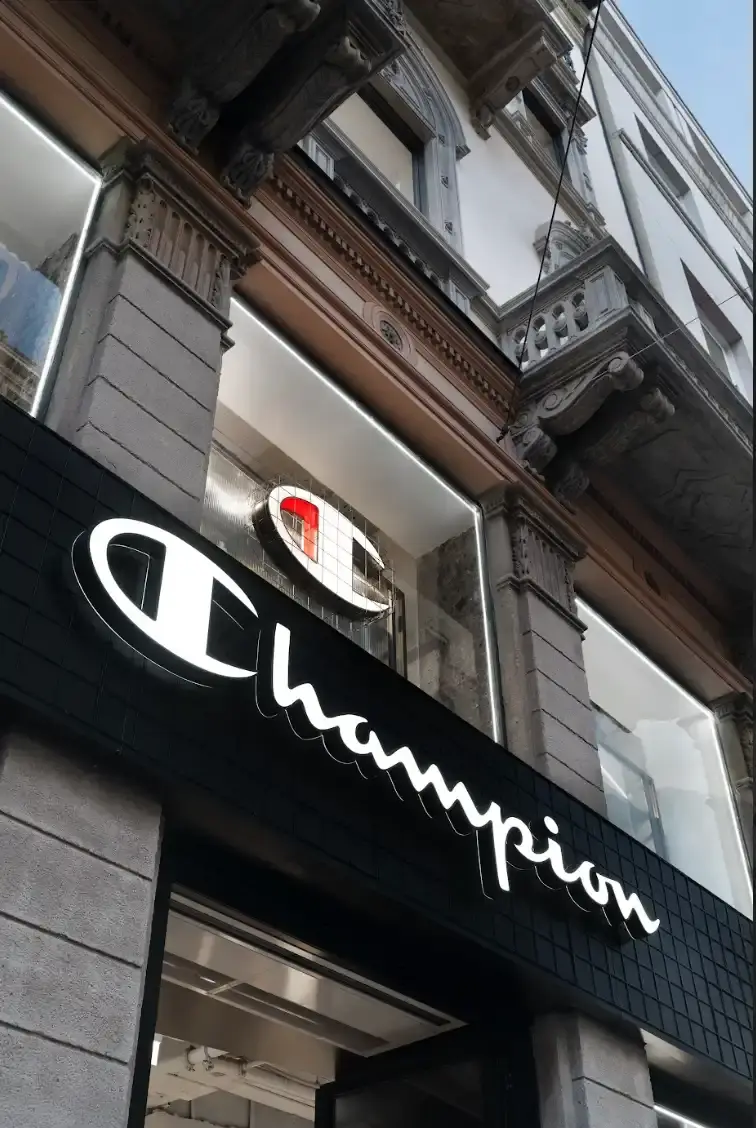 CHAMPION OPENS MILAN FLAGSHIP STORE Article about Champion's new Milan flagship store opening on Via Torino 19, with details on store layout, design concept, and community initiatives. (image 2 of 5)